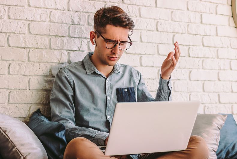 Frustrated man on laptop