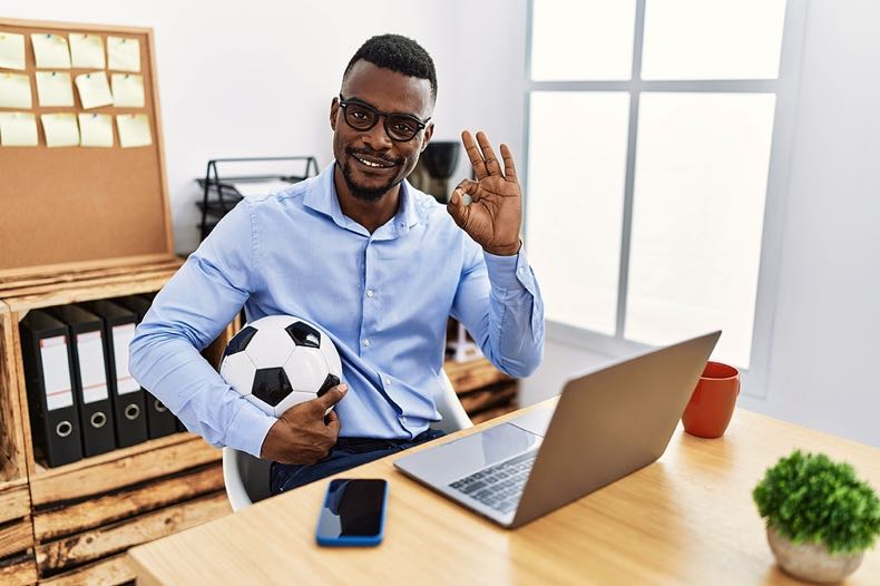 Football fan at laptop