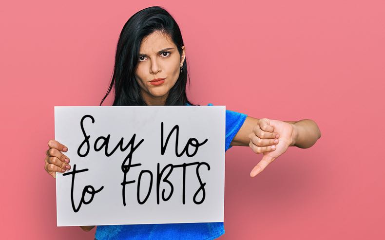 Angry woman holding anti-FOBT sign